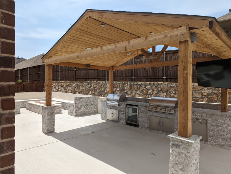 Freestanding cedar pavilion with dual grills and TV mount